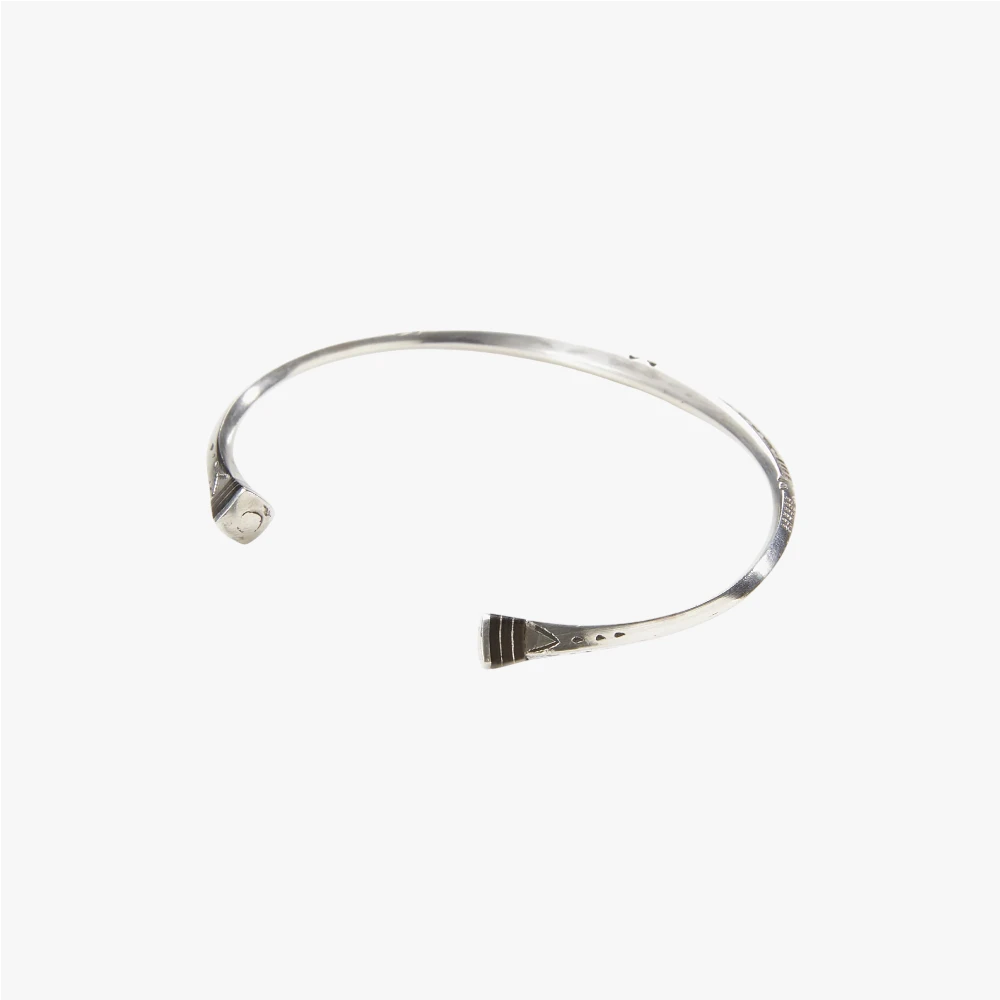 Close-up of the Tafoukt Bracelet highlighting the engraved surface, texture, and artisanal metalwork.