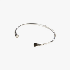 Close-up of the Tafoukt Bracelet highlighting the engraved surface, texture, and artisanal metalwork.