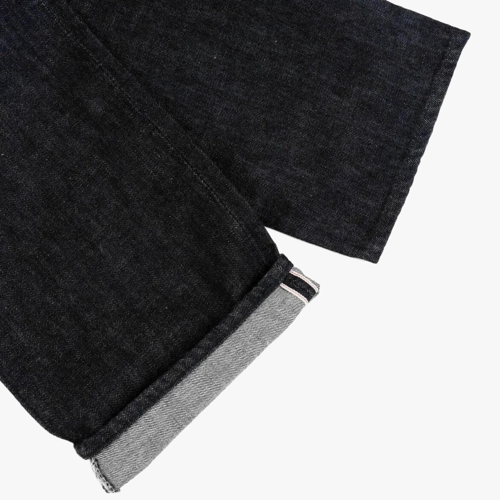 Close-up of the Sydney Black denim showing the weave texture, rich black coloration, and structured hand feel.