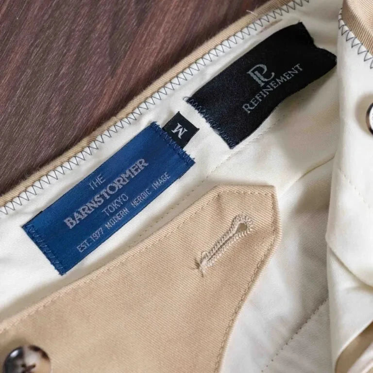 Close-up of the brand tag on the Barnstormer Officer Chino Beige showing label design, stitching, and placement inside the waistband.