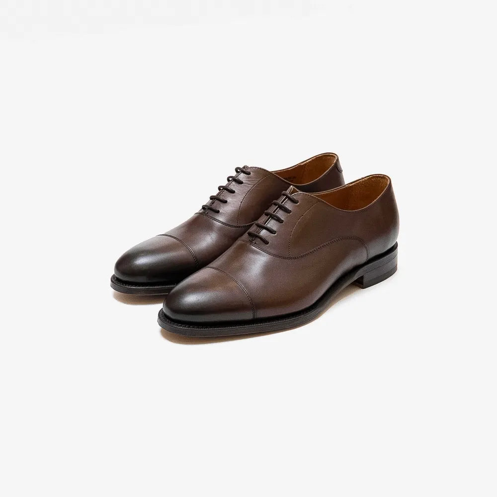 Berwick 4311 Oxford Cap Toe in dark brown Nomera leather, angled front view.