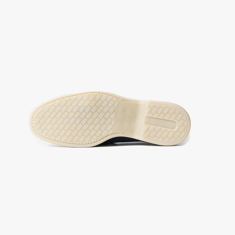Close-up of the flexible leather sole showing clean edge finishing and comfort-focused construction.
