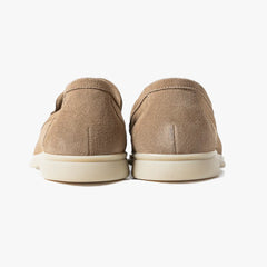 Close-up of the heel showing stacked construction, stitching, and clean shaping.