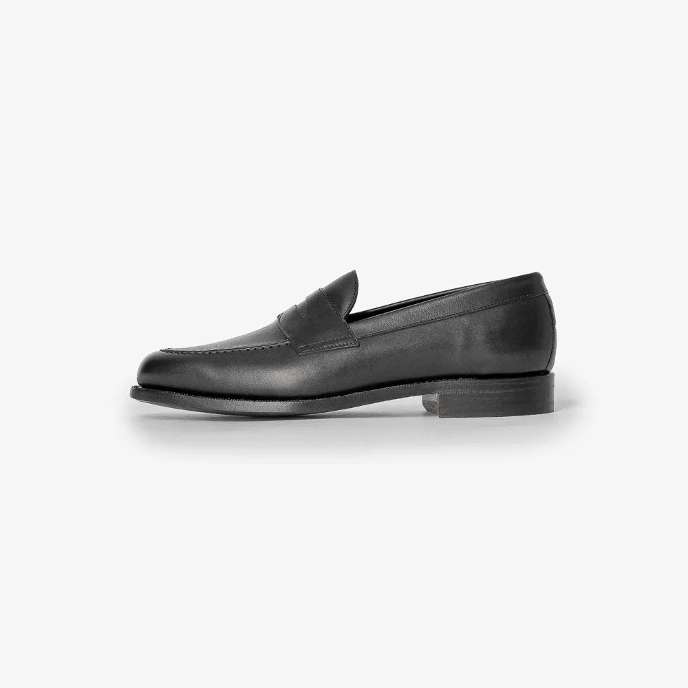 Berwick 5138 Penny Loafer in Chateaubriand black leather, side profile showing sleek silhouette.