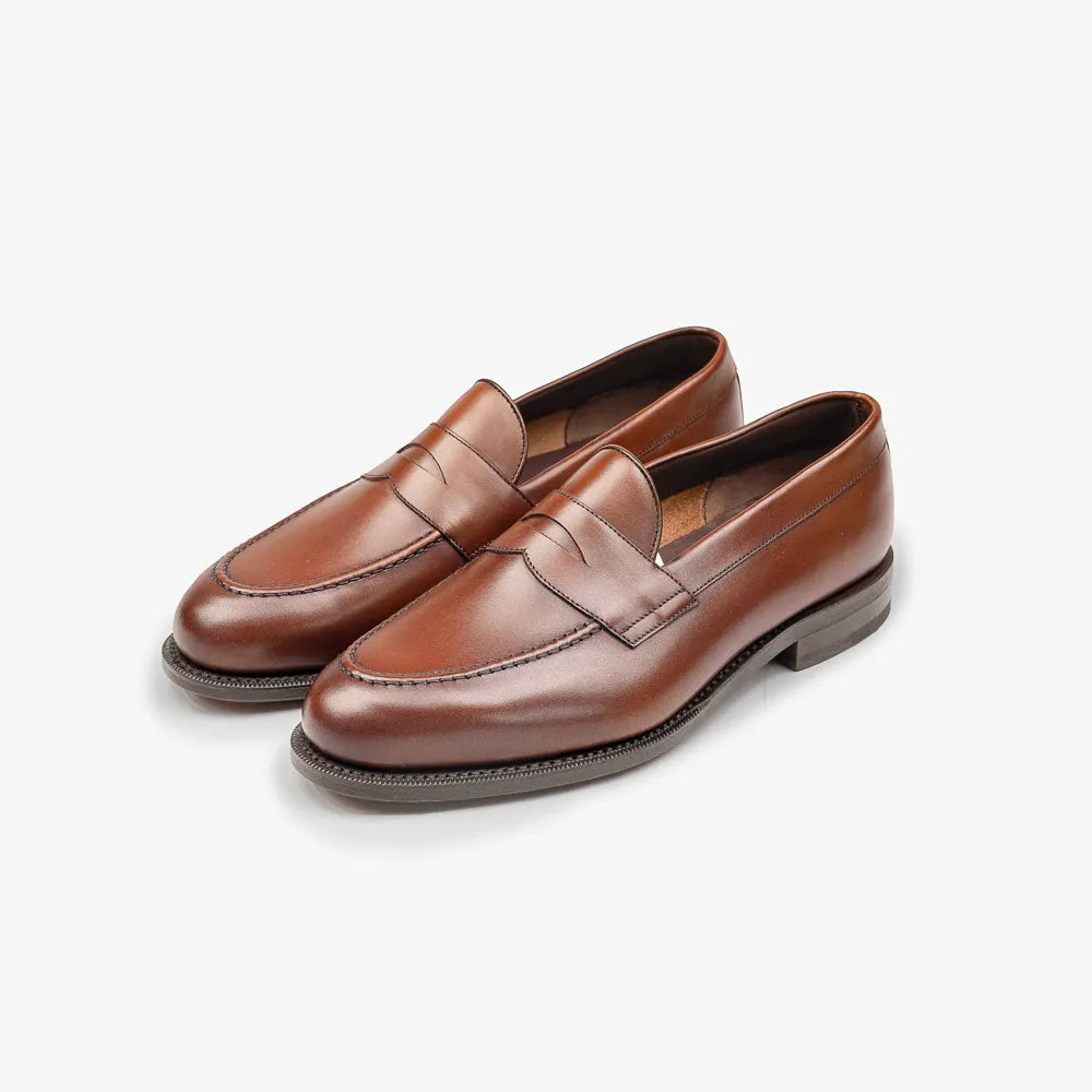 Berwick 5138 Penny Loafer in medium brown leather, angled front view.