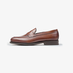 Berwick 5138 Penny Loafer in medium brown leather, side profile showing clean silhouette.
