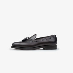 Berwick 5139 Tassel Loafer in Nomera dark brown leather, side profile showing sleek silhouette.