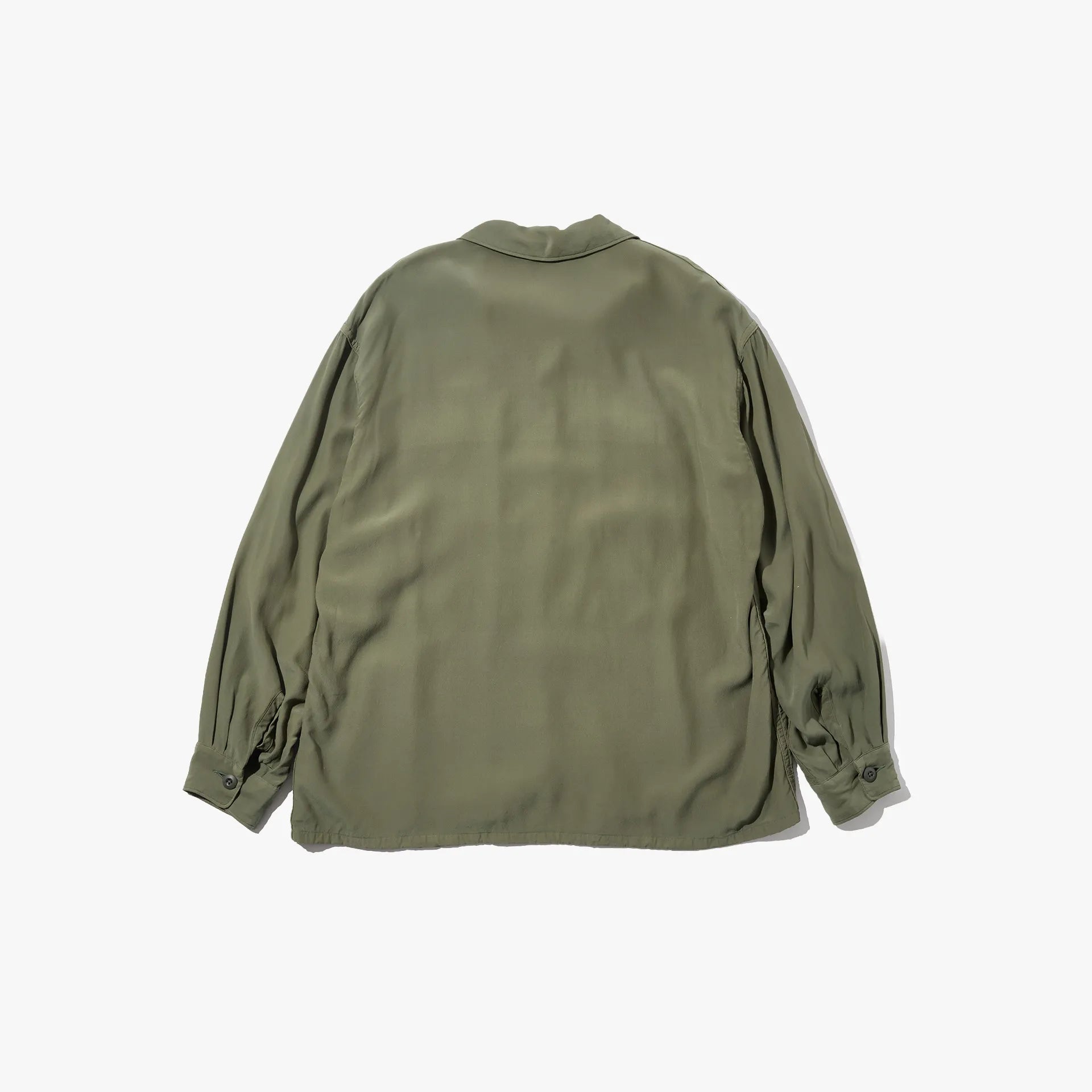 Back view of the Brú Na Bóinne silk military shirt in khaki green showing the relaxed structure and minimal detailing.
