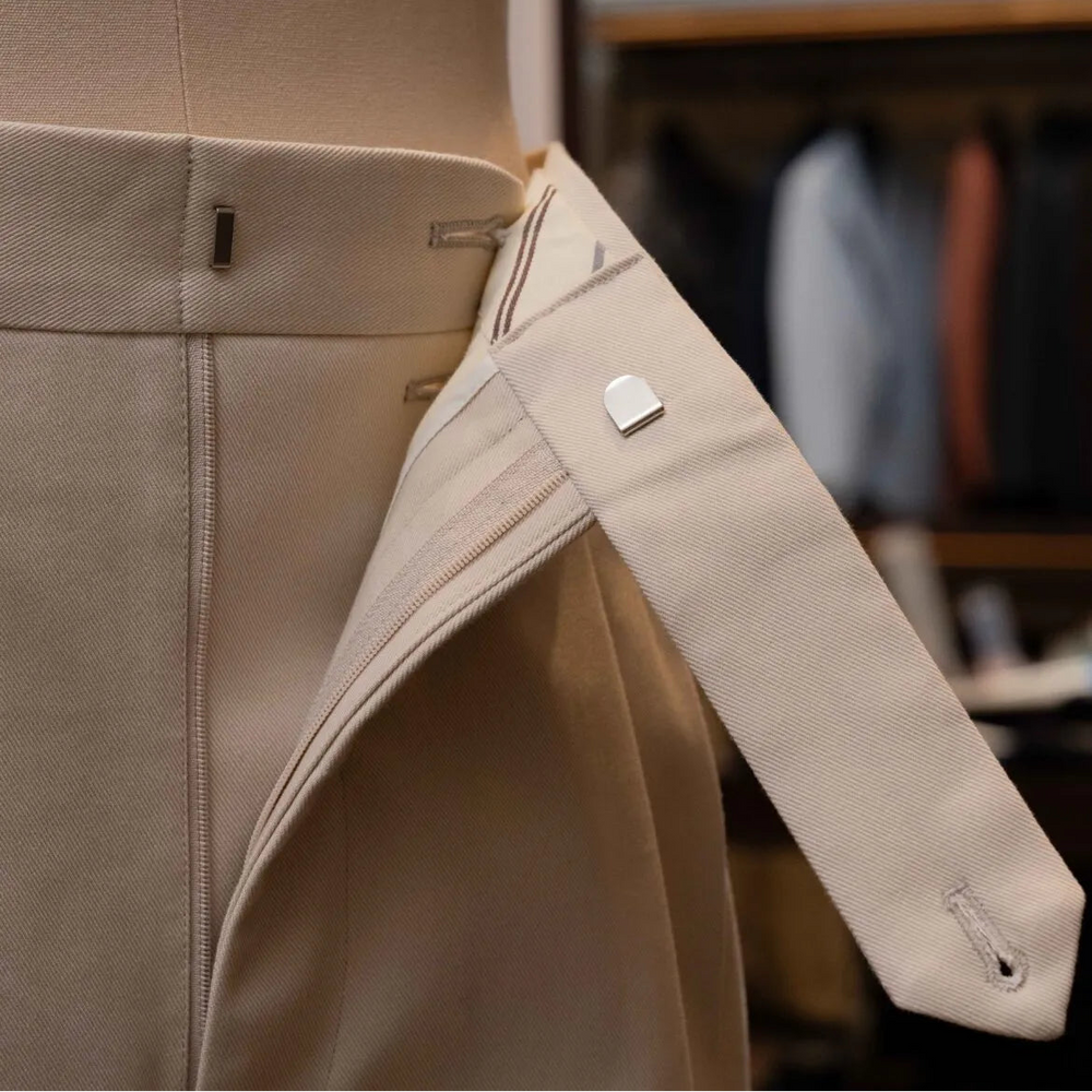 Close-up of the waistband button on the Calsa Nagasaki Trousers Cotton Beige