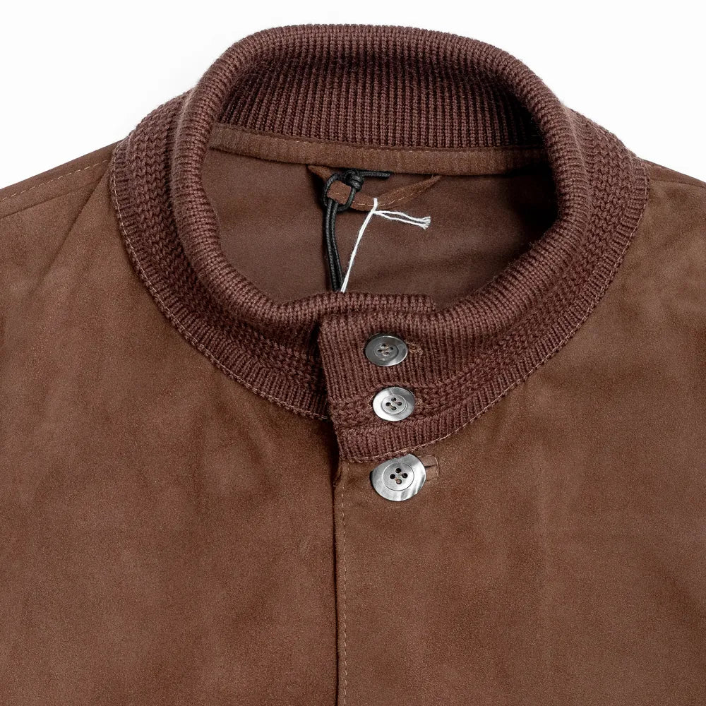 Close-up of the standing collar showing suede texture, edge stitching, and refined Italian construction.