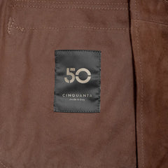 Close-up of the interior label of the Cinquanta Driving Blouson Castagna showing branding and inner lining craftsmanship.
