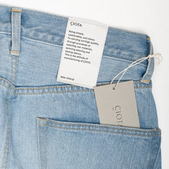 Close-up of the front pocket and coin pocket highlighting stitching and worn-in texture.