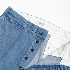 Close-up of the fly showing zipper and button construction with reinforced stitching.