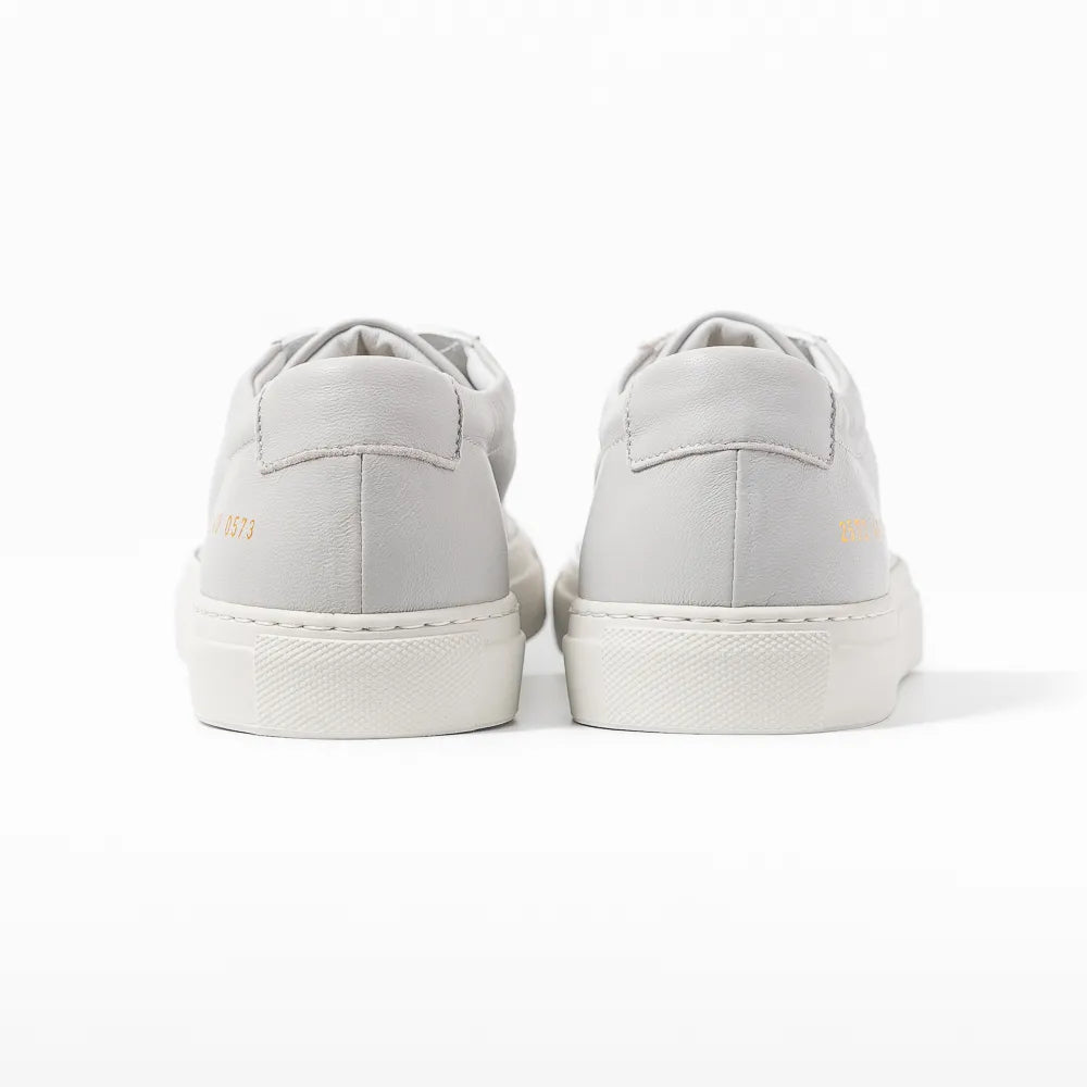 Close-up of the heel tab showing leather texture and refined finishing.