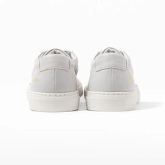 Close-up of the heel tab showing leather texture and refined finishing.