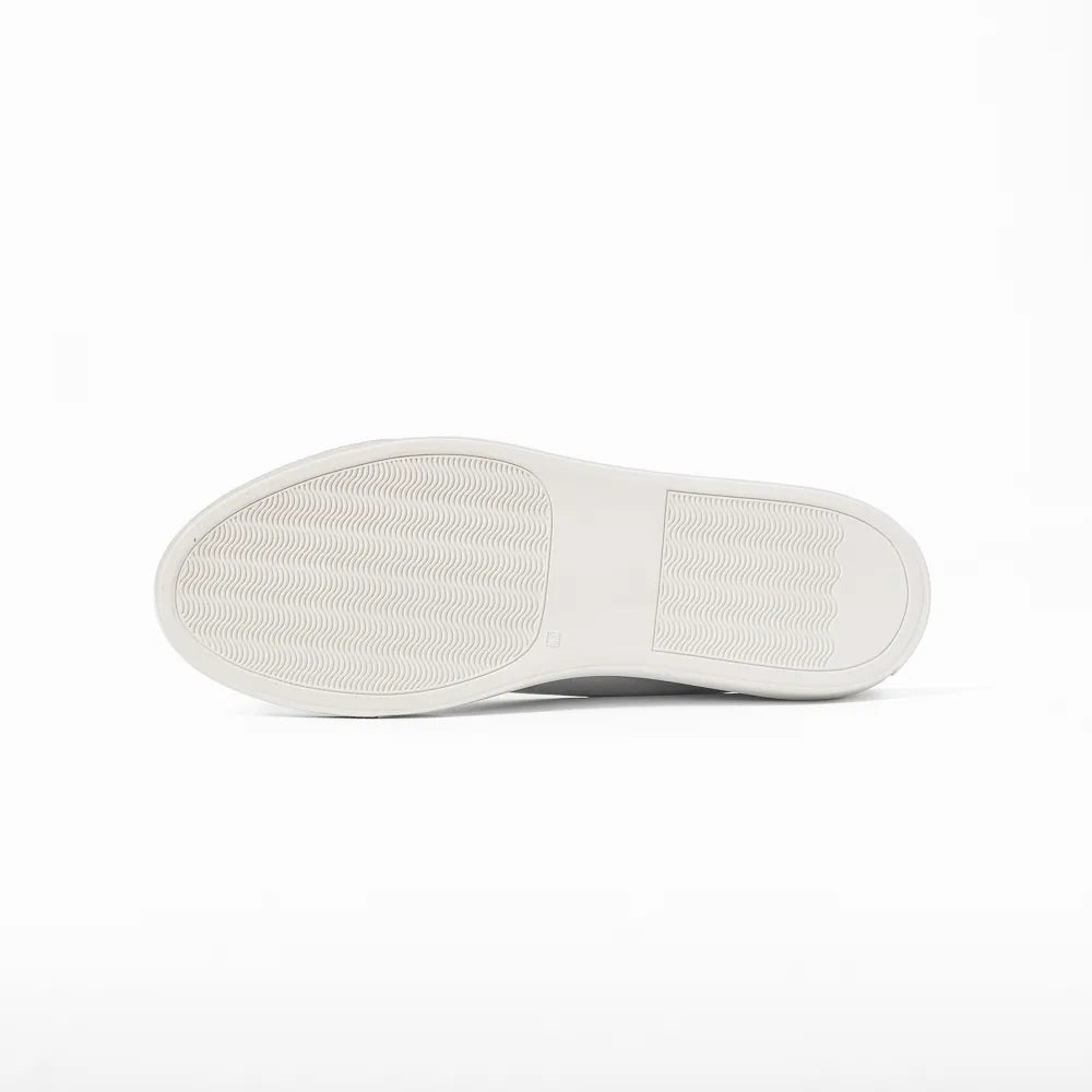 Close-up of the rubber sole showing clean edge finishing and durable construction.

