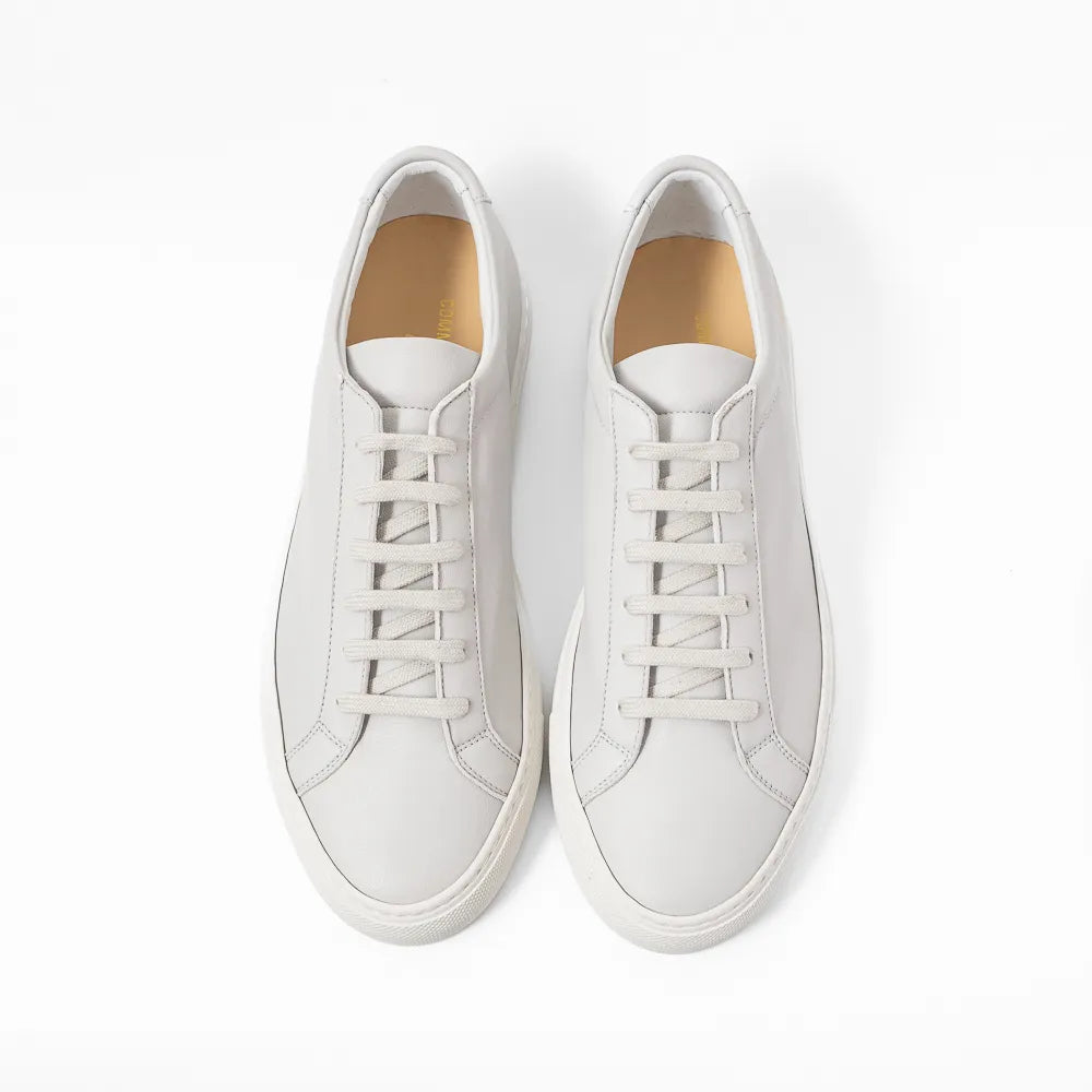 Top view of the sneaker showing lace layout, tongue shape, and clean toe box construction.
