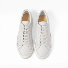 Top view of the sneaker showing lace layout, tongue shape, and clean toe box construction.
