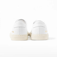 Close-up of the heel tab showing leather texture and refined finishing.