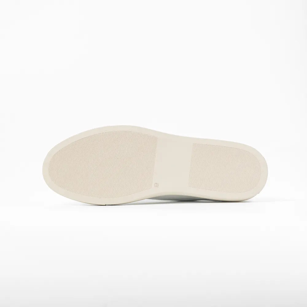 Close-up of the rubber sole showing clean edge finishing and durable construction.