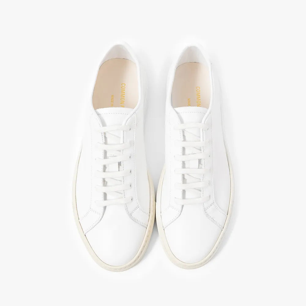 Top view of the sneaker showing lace layout, tongue shape, and clean toe box construction.