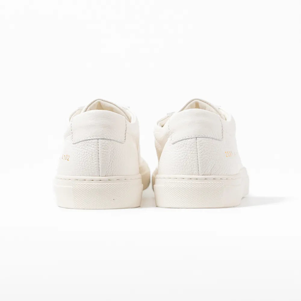 Close-up of the heel counter showing grained leather texture and refined finishing.