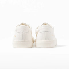 Close-up of the heel counter showing grained leather texture and refined finishing.