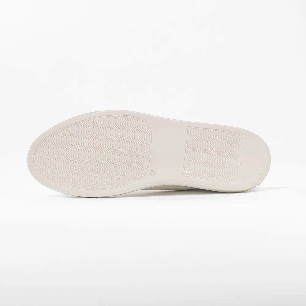 Close-up of the rubber sole showing clean edge finishing and durable construction.