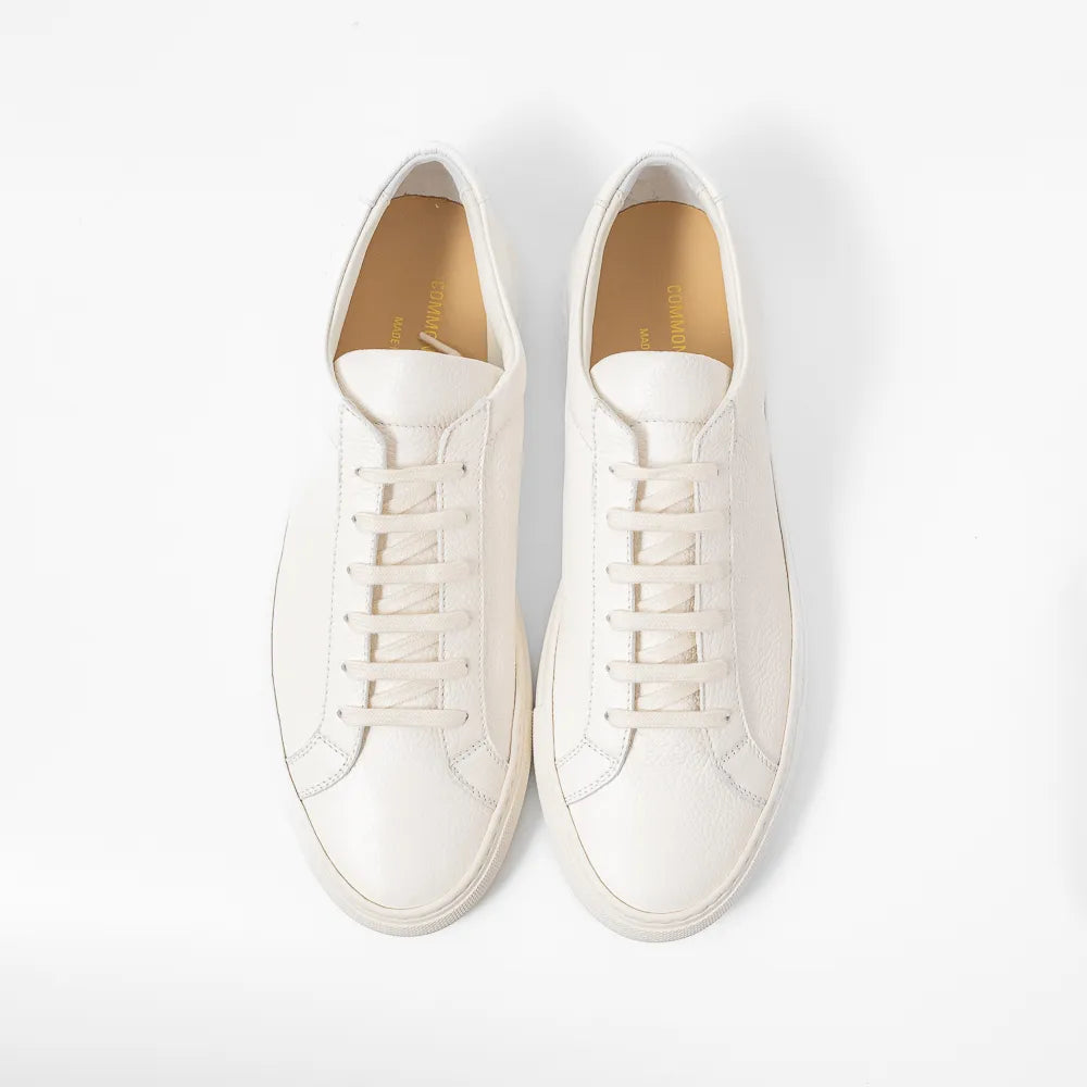 Top view of the sneaker showing lace layout, tongue structure, and clean toe box shape.