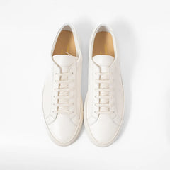 Top view of the sneaker showing lace layout, tongue structure, and clean toe box shape.