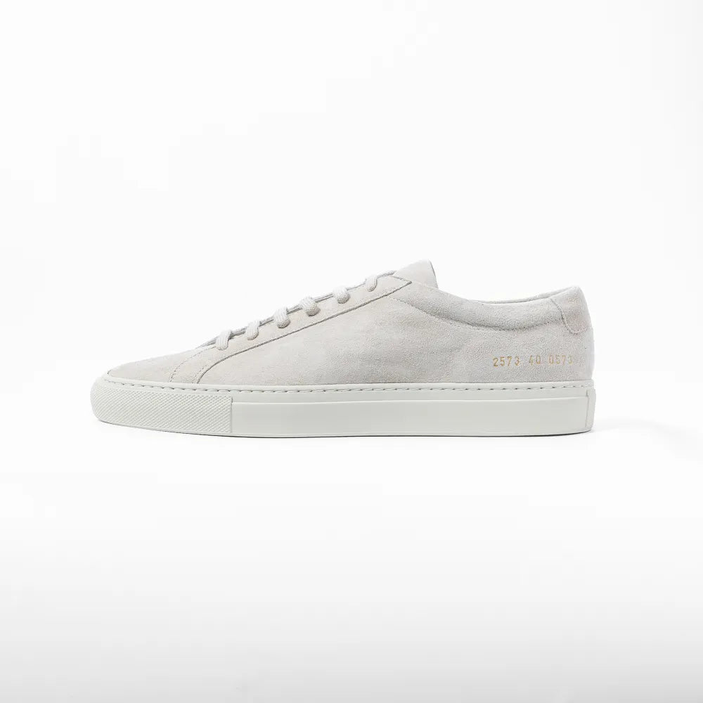 Side view highlighting the suede finish and signature gold serial number detail.