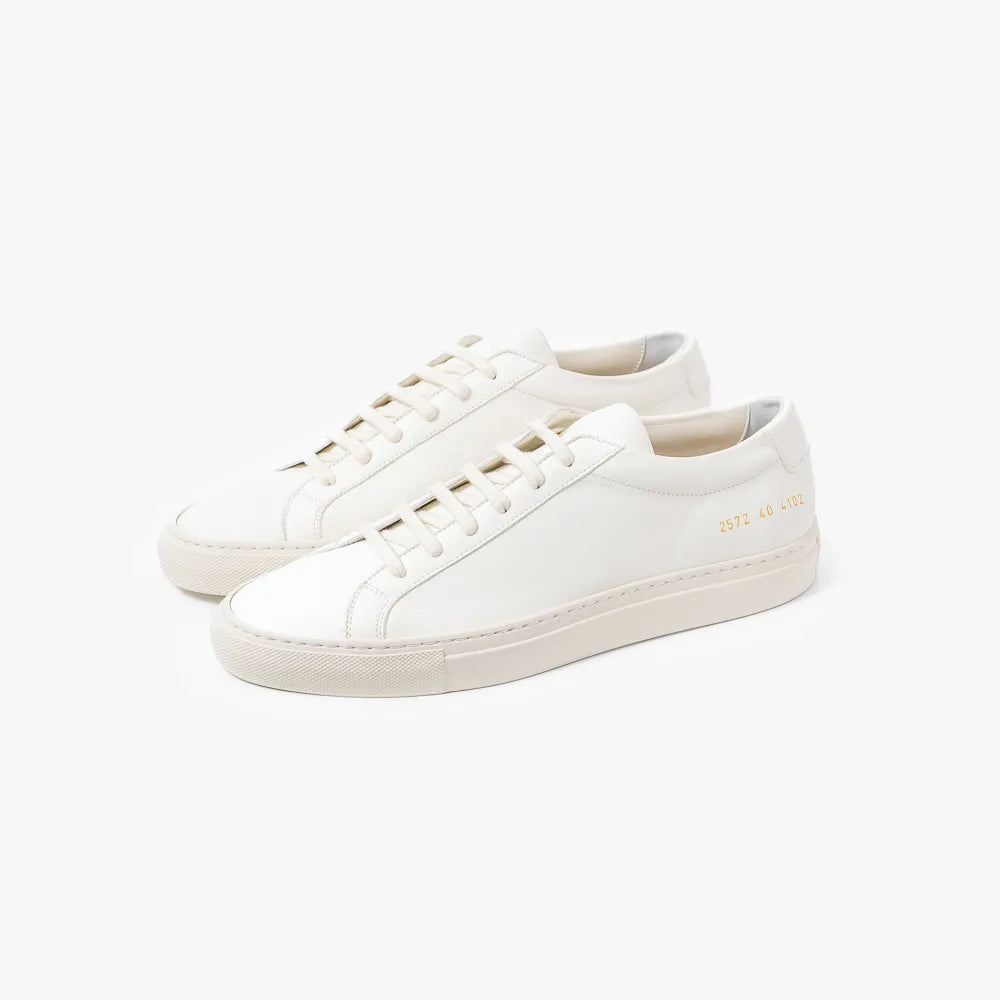 Full view of the Common Projects Achilles Slim Premium 2575 in white featuring a streamlined low-top silhouette and smooth leather finish.
