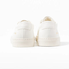 Close-up of the heel counter showing smooth white leather and refined finishing.