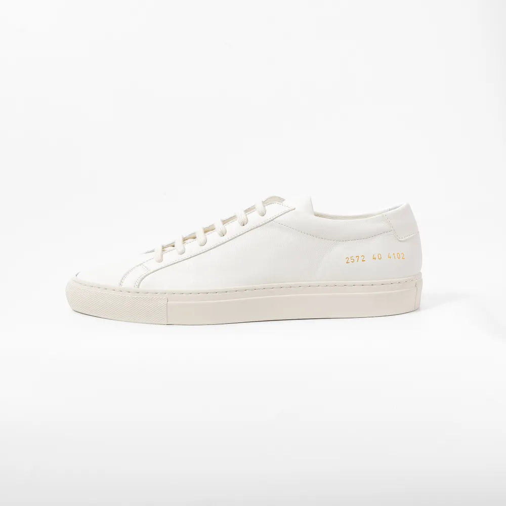 Side view highlighting the slim profile and signature gold serial number detail.