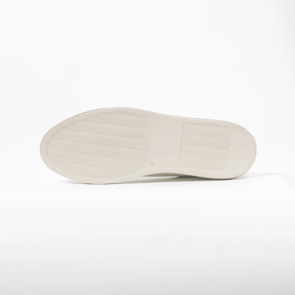 Close-up of the rubber sole showing clean edge finishing and durable construction.
