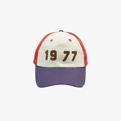 Front view of the Drake’s 1977’ Cotton Twill Baseball Cap showing the embroidered “1977” graphic and structured cotton twill panels.
