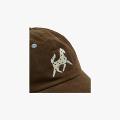 Side view showing the cap’s profile, curved brim, and rich moleskin fabric surface.