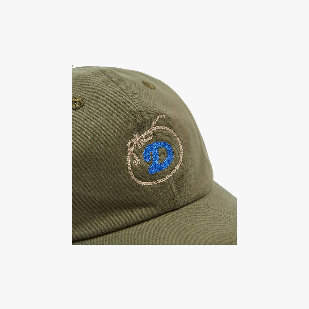 Side view showing the cap’s profile, curved brim, and durable twill texture.