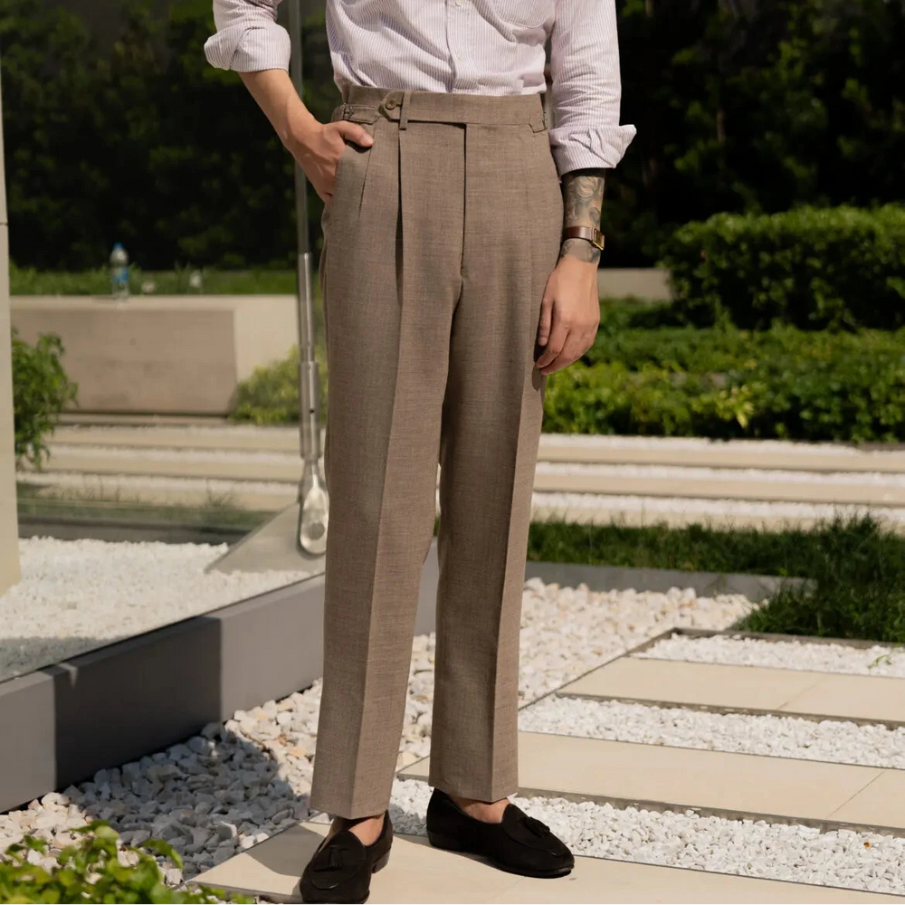 Full body front view of a model wearing the Drummers Trousers Beige showing the straight-leg fit, clean drape, and natural stance.