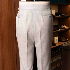 Back view of the Drummers Trousers Light Grey highlighting the back pockets, seam finishing, and structured drape.