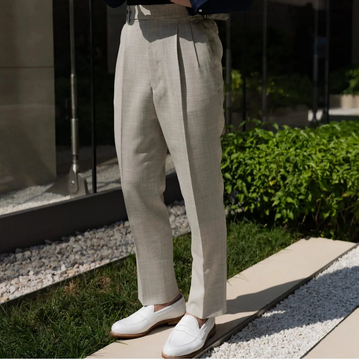 Full body front view of a model wearing the Drummers Trousers Light Grey showing the straight leg fit, clean drape, and natural stance.