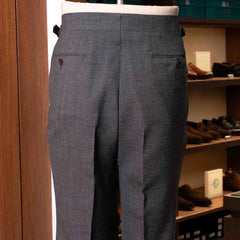 Back view of the Drummers Trousers Mid Grey highlighting the back pockets, seam finishing, and structured drape.