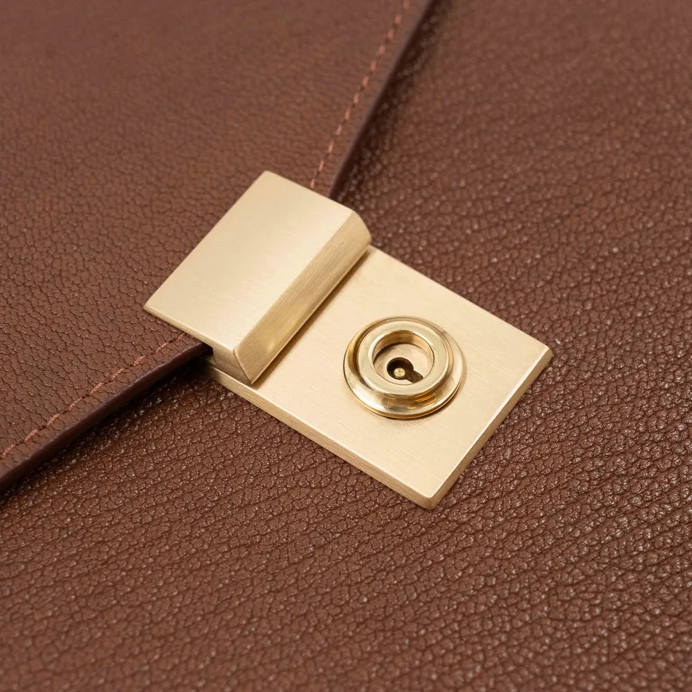 Lock detail of the Frank Clegg 15-inch Lock Portfolio Case Goatskin Antique