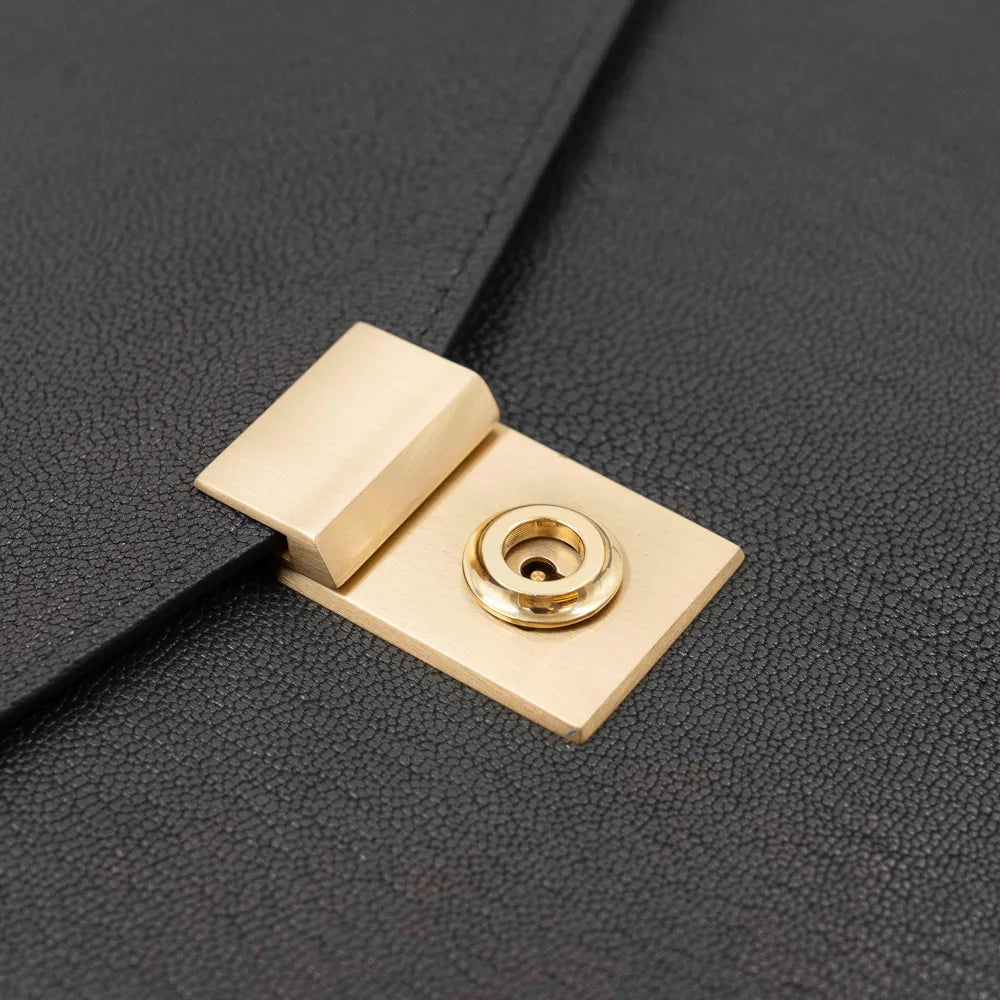 Lock detail of the Frank Clegg 15-inch Lock Portfolio Case Goatskin Black