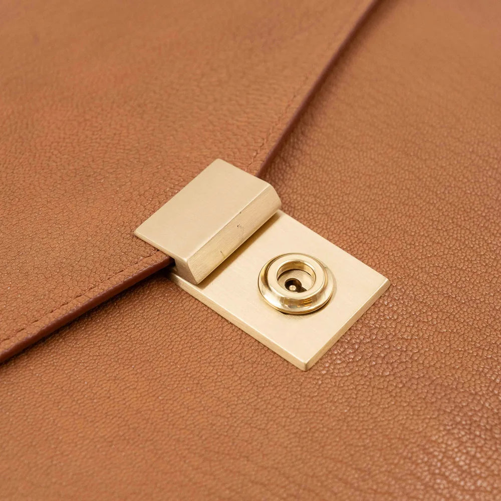 Lock detail of the Frank Clegg 15-inch Lock Portfolio Case Goatskin Camel