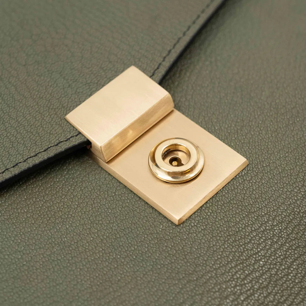 Lock detail of the Frank Clegg 15-inch Lock Portfolio Case Goatskin Mint