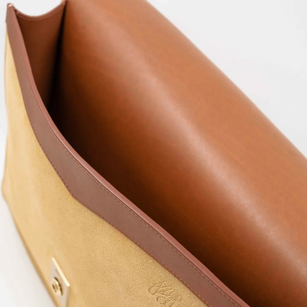 Gusset side view of the Frank Clegg 15-inch Lock Portfolio Case Suede Sand/Cognac