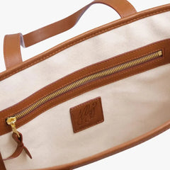 Interior zip pocket of the Frank Clegg Canvas Market Tote Bag Natural