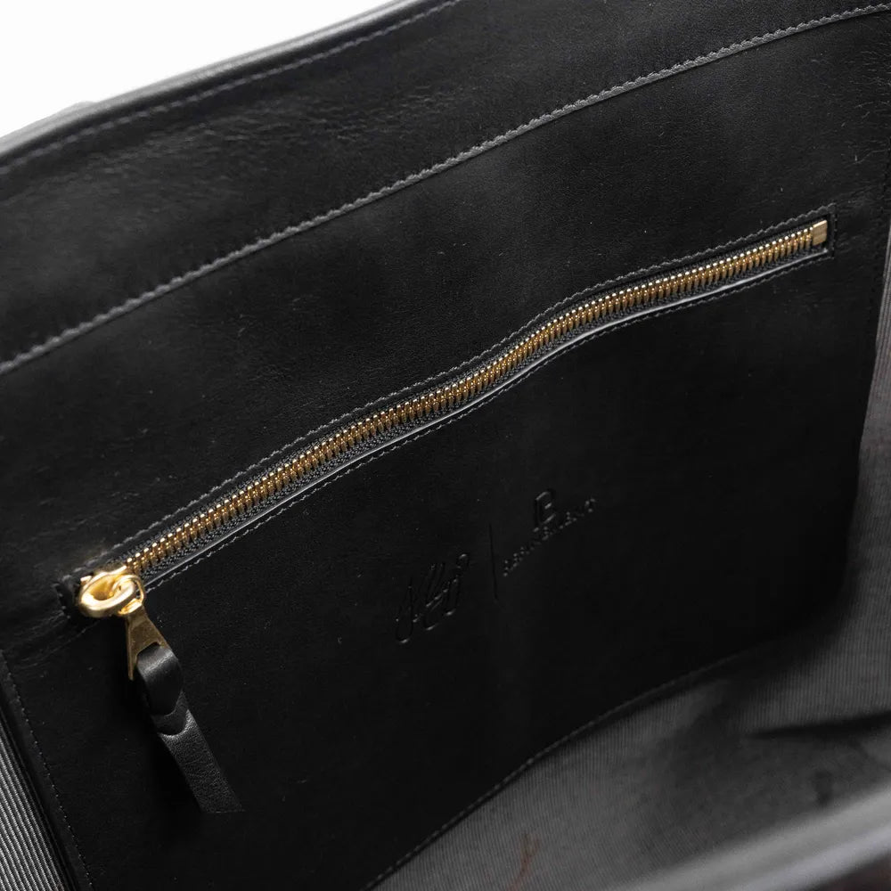 Interior zip pocket of the Frank Clegg for Refinement Goat Black Tote Bag