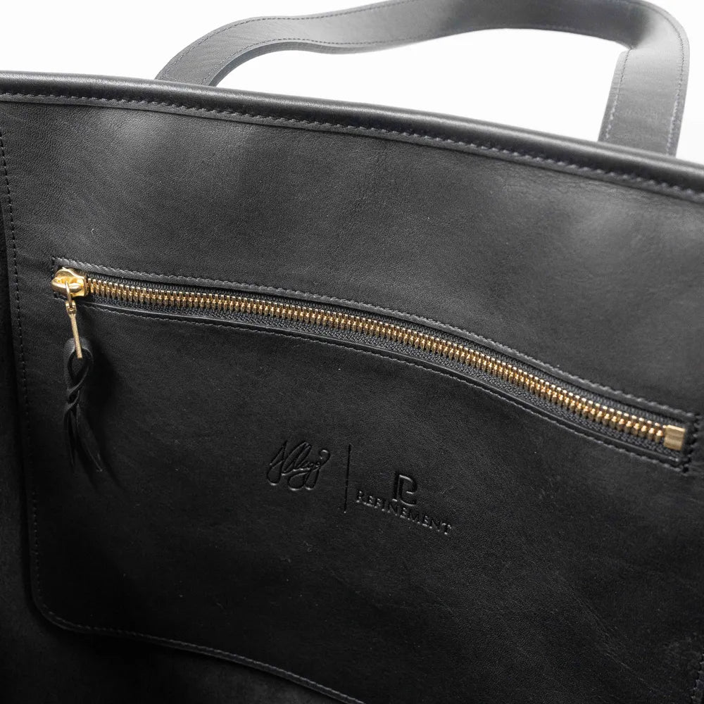 Interior zip pocket of the Frank Clegg Leather Market Tote Bag Black
